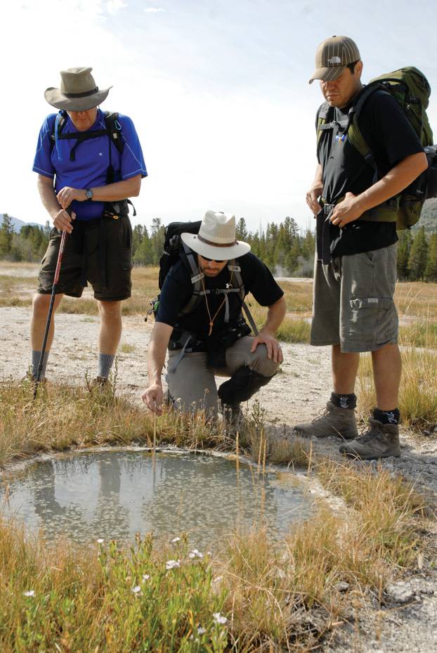 MSU researchers sampling water from hot spring in Yellowstone
